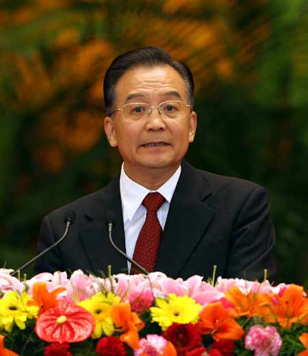 Chinese Premier Wen Jiabao stressed here Sunday the government's determination to advance reform and opening-up on the eve of the 58th founding anniversary of the People's Republic of China(PRC), two weeks ahead of the 17th National Congress of the Communist Party of China (CPC).